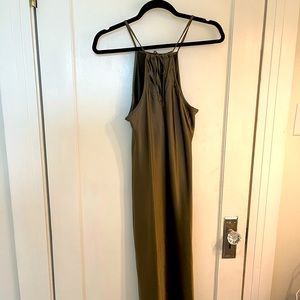 Green dress, silky material. Halter style neck. Ties in the back